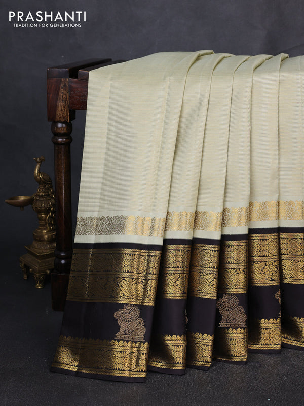 Puer kanchipuram silk saree pastel green and black with allover vairaosi pattern and long zari woven border