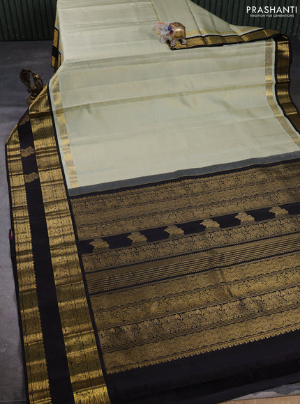 Puer kanchipuram silk saree pastel green and black with allover vairaosi pattern and long zari woven border