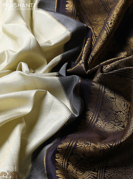 Puer kanchipuram silk saree pastel green and black with allover vairaosi pattern and long zari woven border