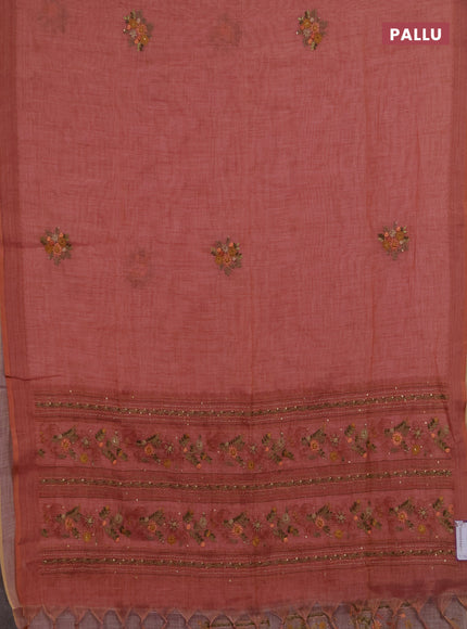 Linen saree dark peach with embroidery buttas and embroidery pallu