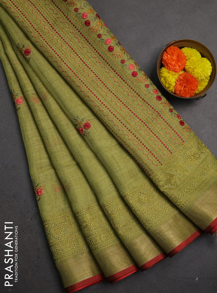 Linen saree light green with embroidery buttas and embroidery pallu & border