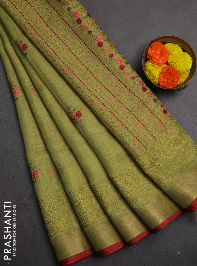 Linen saree light green with embroidery buttas and embroidery pallu & border