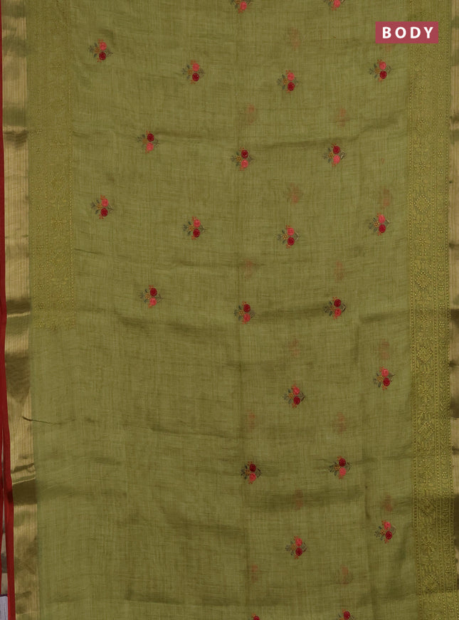 Linen saree light green with embroidery buttas and embroidery pallu & border