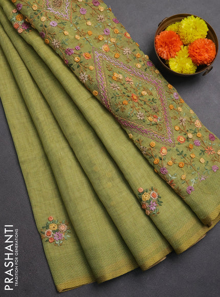 Linen saree light green with embroidery buttas and embroidery pallu
