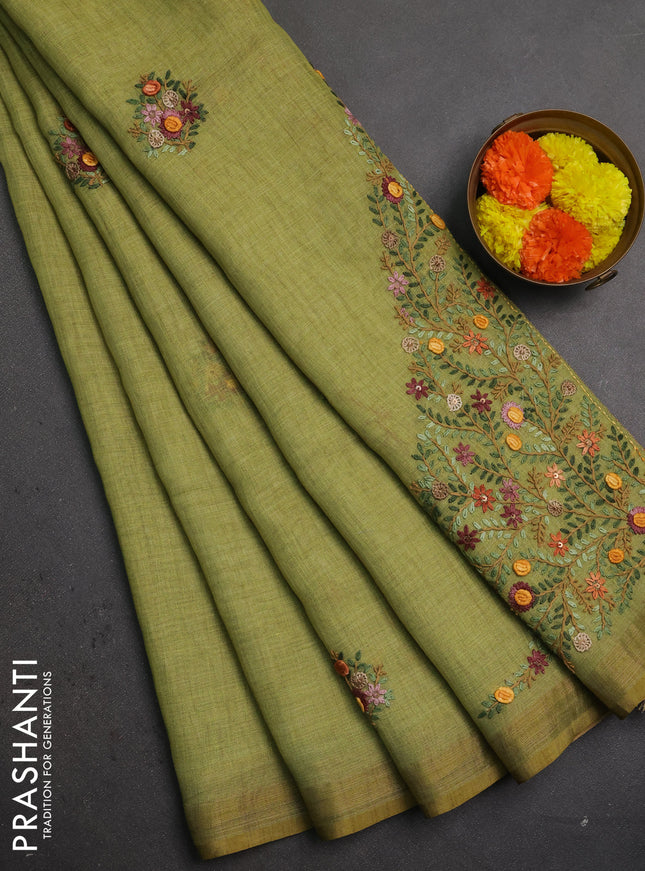 Linen saree light green with embroidery buttas and embroidery pallu