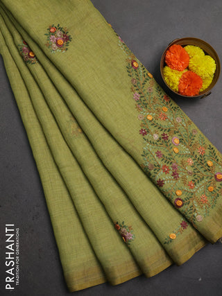 Linen saree light green with embroidery buttas and embroidery pallu