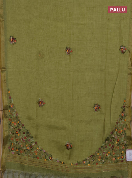 Linen saree light green with embroidery buttas and embroidery pallu
