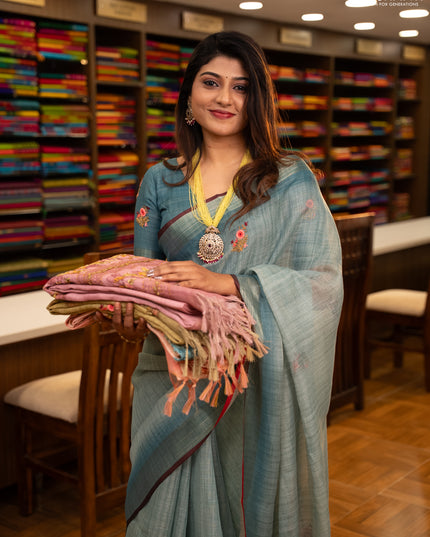 Linen saree teal blue and maroon with embroidery buttas and embroidery pallu