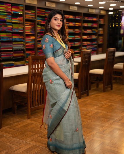 Linen saree teal blue and maroon with embroidery buttas and embroidery pallu