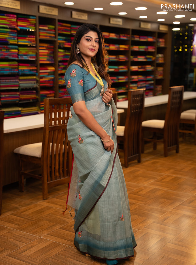 Linen saree teal blue and maroon with embroidery buttas and embroidery pallu