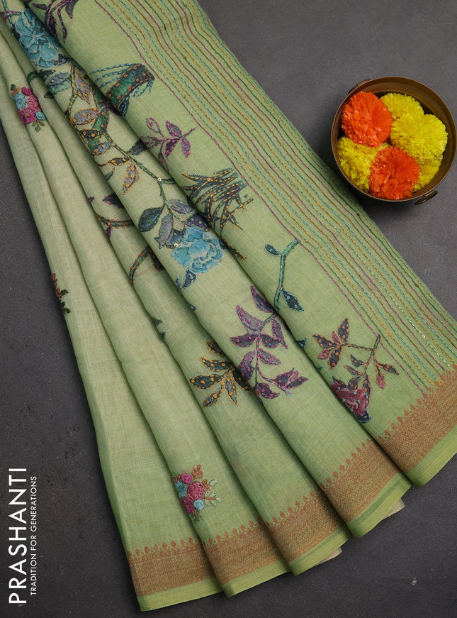 Linen saree pista green with embroidery buttas and embroidery pallu