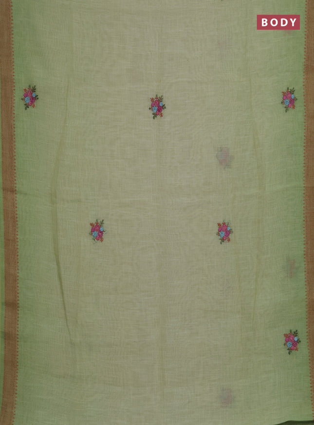 Linen saree pista green with embroidery buttas and embroidery pallu