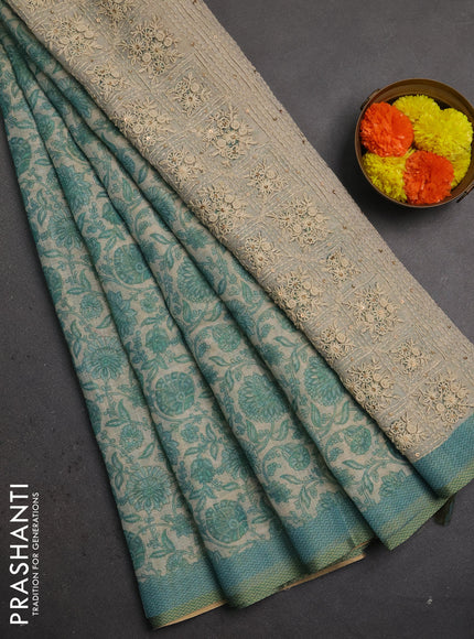 Linen saree beige and teal blue with allover floral prints and embroidery pallu