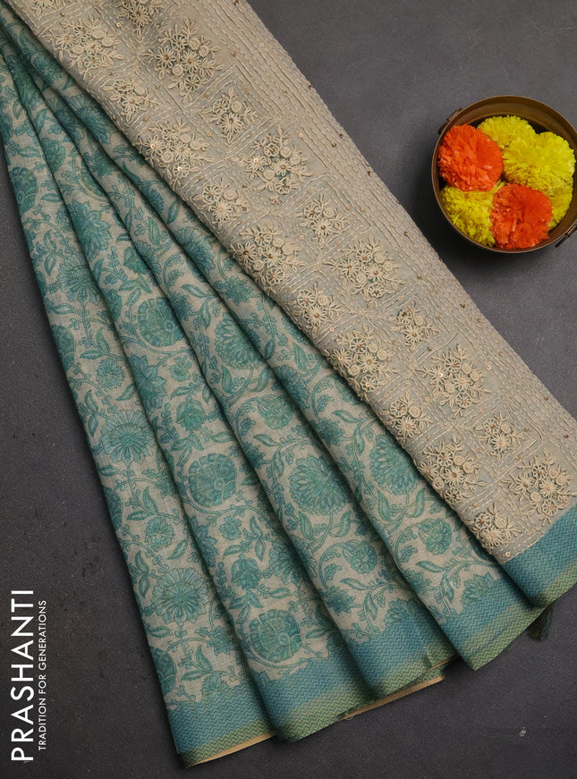 Linen saree beige and teal blue with allover floral prints and embroidery pallu