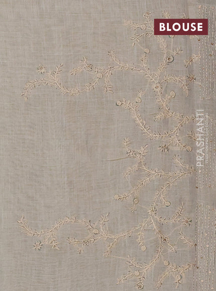 Linen saree beige and teal blue with allover floral prints and embroidery pallu