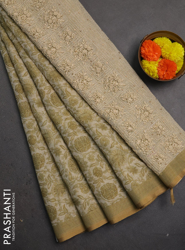 Linen saree beige and mehendi green with allover floral prints and embroidery pallu
