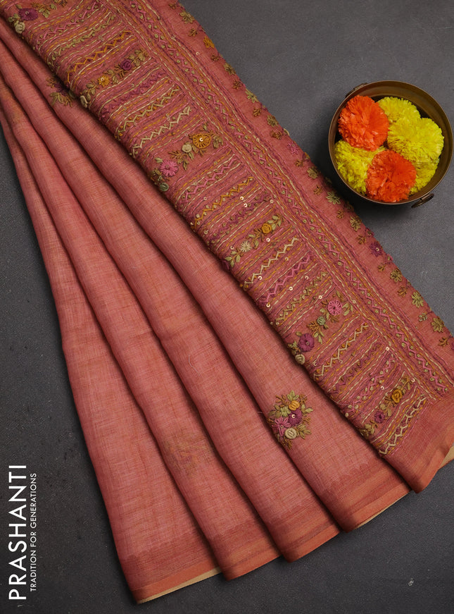 Linen saree dark peach with embroidery buttas and embroidery pallu