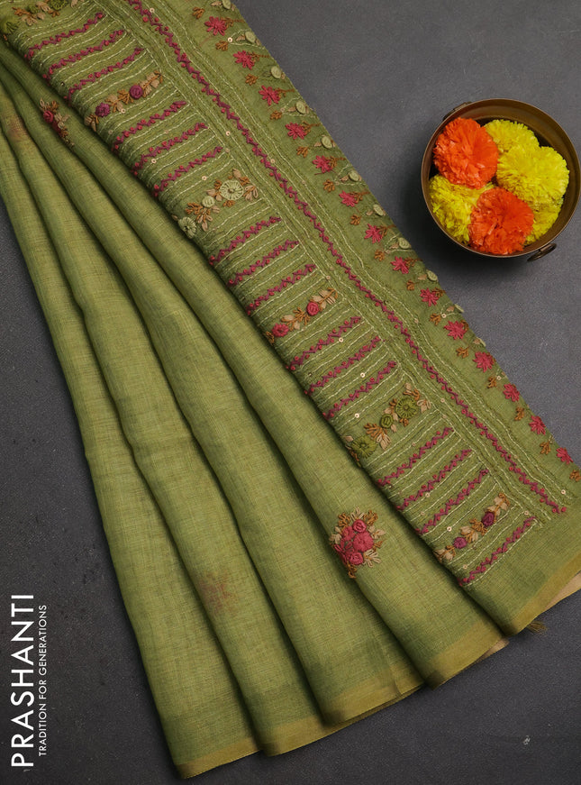 Linen saree light green with embroidery buttas and embroidery pallu
