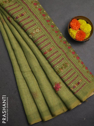 Linen saree light green with embroidery buttas and embroidery pallu