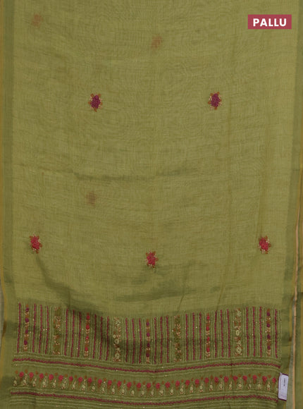 Linen saree light green with embroidery buttas and embroidery pallu