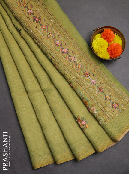 Linen saree light green with embroidery buttas and embroidery pallu