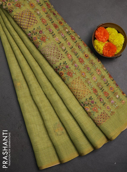 Linen saree light green with embroidery buttas and embroidery pallu