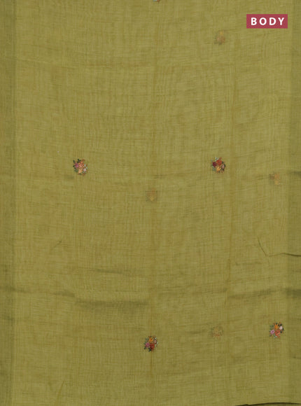 Linen saree light green with embroidery buttas and embroidery pallu