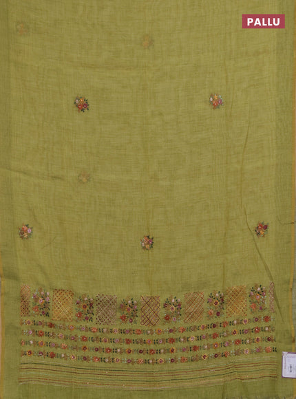 Linen saree light green with embroidery buttas and embroidery pallu