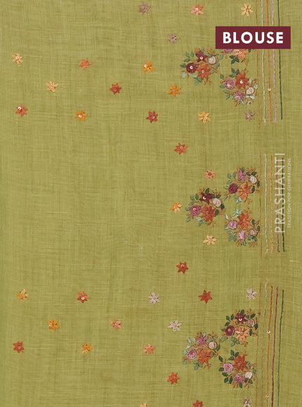 Linen saree light green with embroidery buttas and embroidery pallu