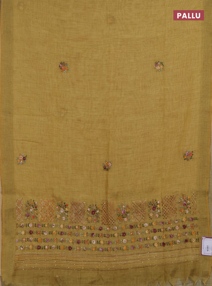 Linen saree dark mustard with embroidery buttas and embroidery pallu