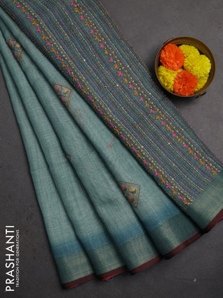Linen saree teal blue and maroon with embroidery buttas and embroidery pallu
