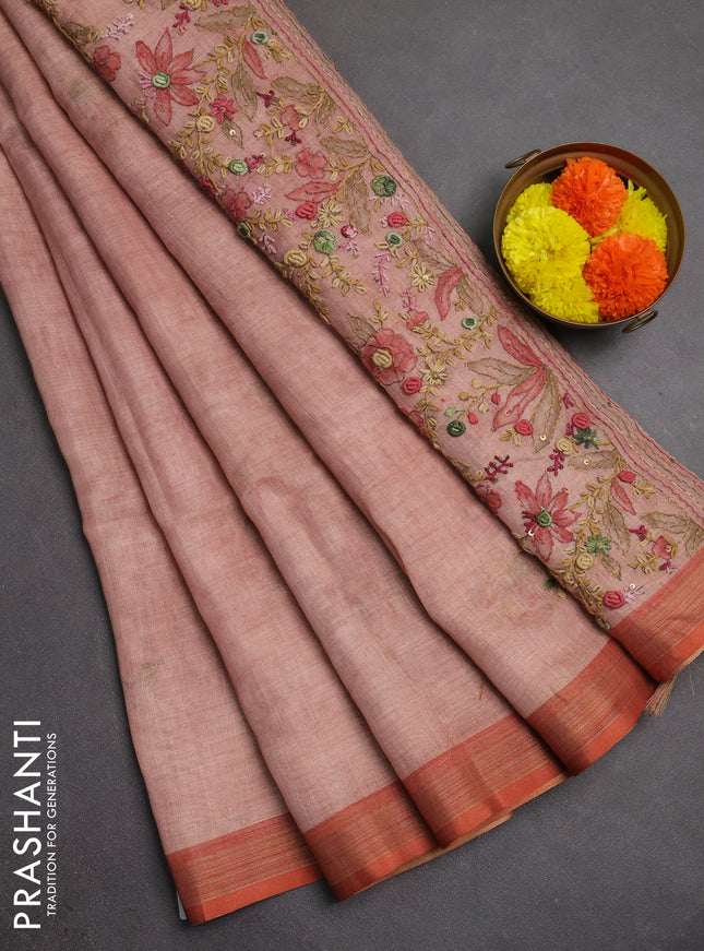 Linen saree peach shade with embroidery buttas and embroidery pallu