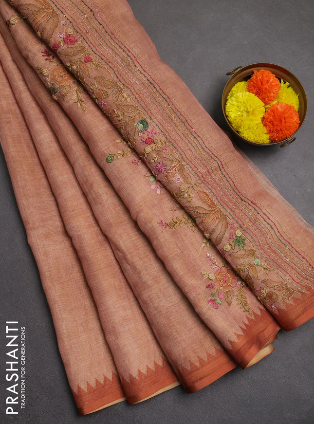 Linen saree rust shade with embroidery buttas and embroidery pallu