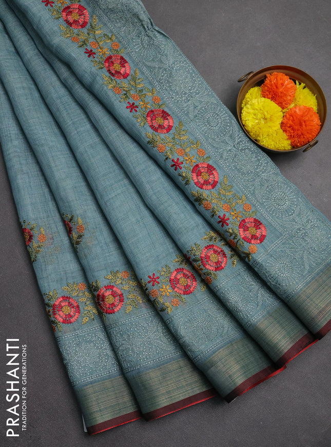 Linen saree pastel blue and maroon with embroidery buttas and embroidery pallu & border