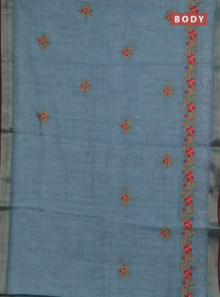Linen saree pastel blue and maroon with embroidery buttas and embroidery pallu & border