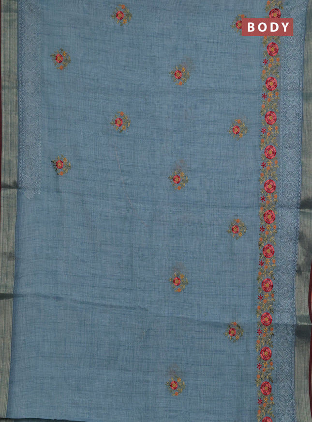 Linen saree pastel blue and maroon with embroidery buttas and embroidery pallu & border