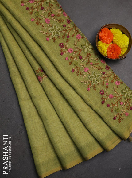 Linen saree light green with embroidery buttas and embroidery pallu