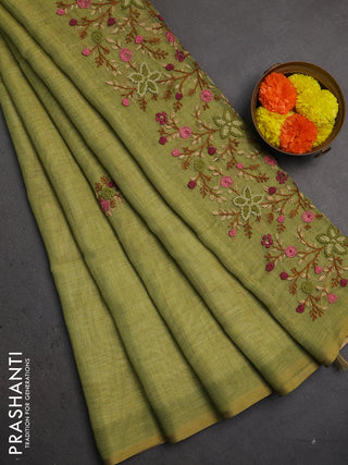 Linen saree light green with embroidery buttas and embroidery pallu