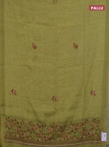 Linen saree light green with embroidery buttas and embroidery pallu