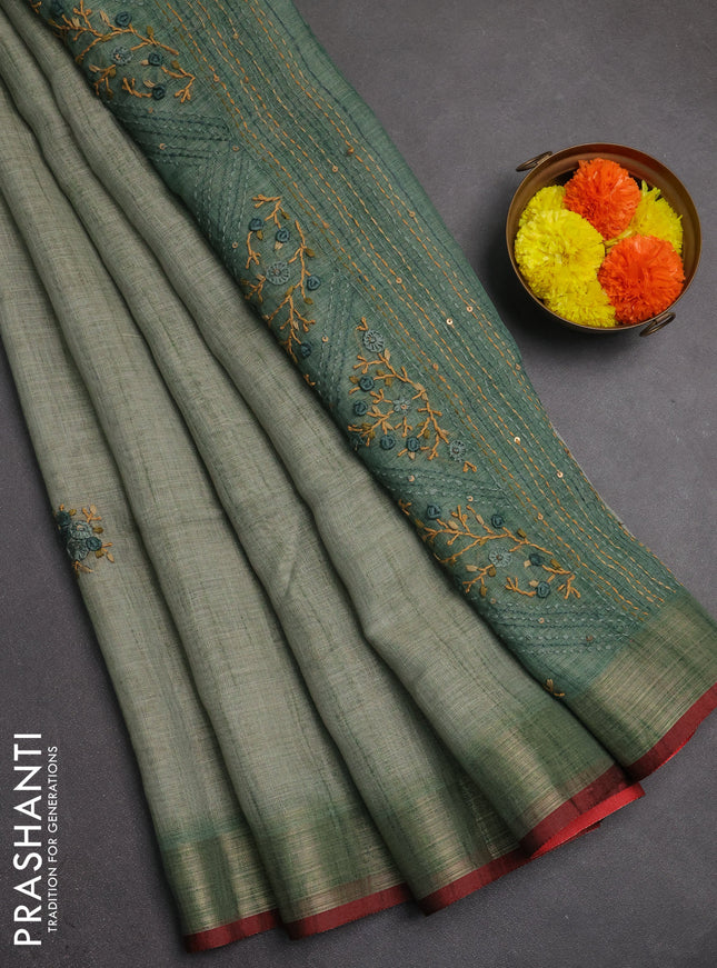 Linen saree pastel green and maroon with embroidery buttas and embroidery pallu
