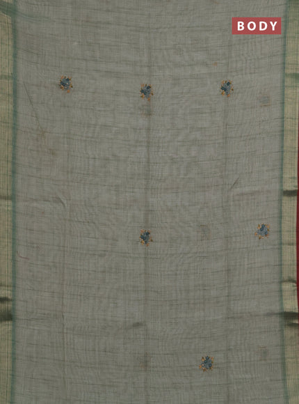 Linen saree pastel green and maroon with embroidery buttas and embroidery pallu
