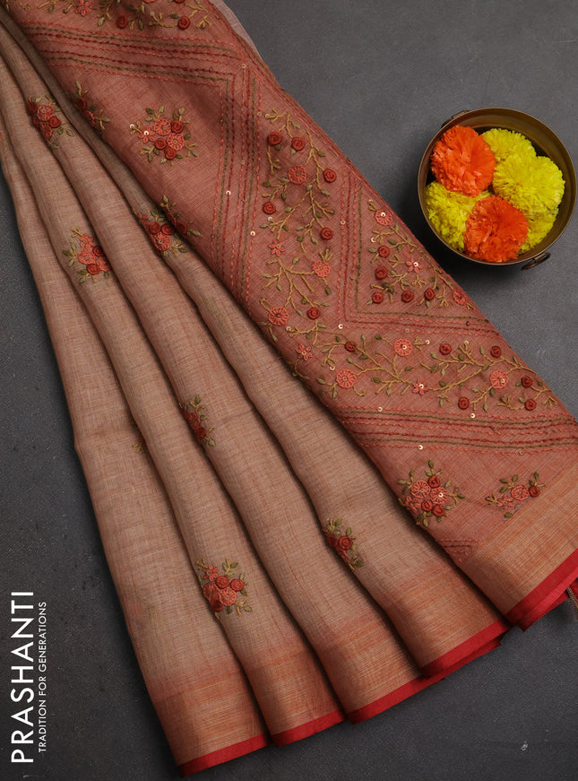 Linen saree rust shade and maroon with embroidery buttas and embroidery pallu