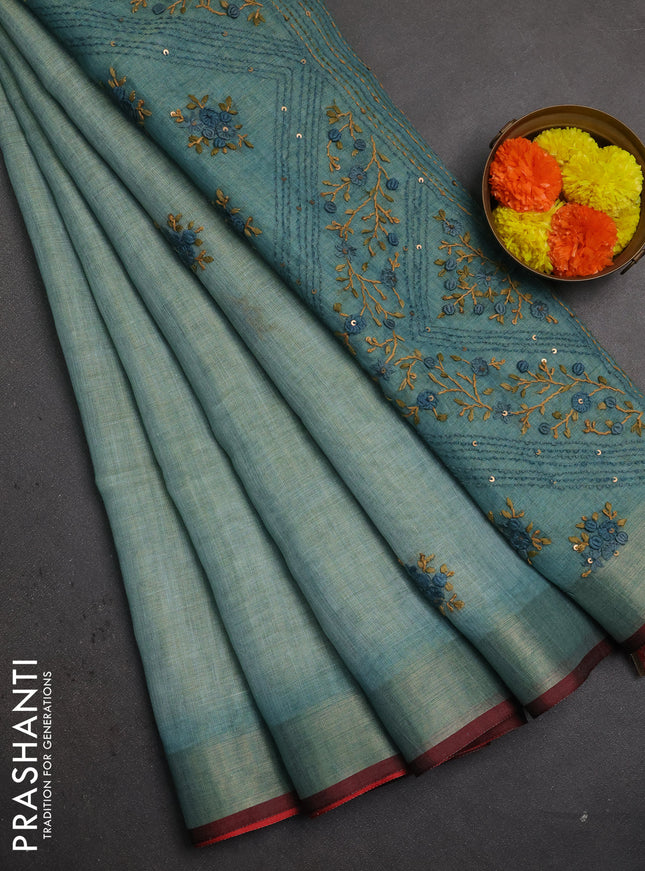 Linen saree teal blue and maroon with embroidery buttas and embroidery pallu