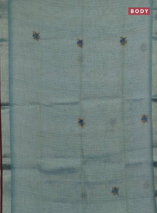 Linen saree teal blue and maroon with embroidery buttas and embroidery pallu