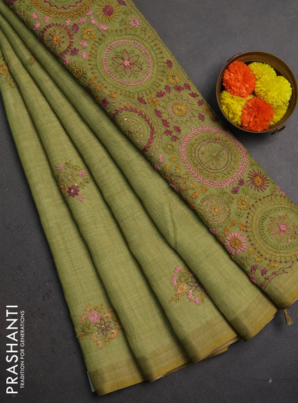 Linen saree light green with embroidery buttas and embroidery pallu