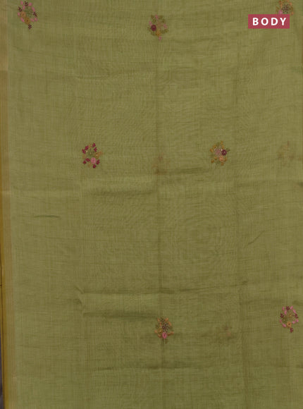 Linen saree light green with embroidery buttas and embroidery pallu