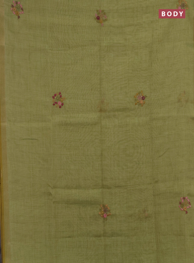Linen saree light green with embroidery buttas and embroidery pallu