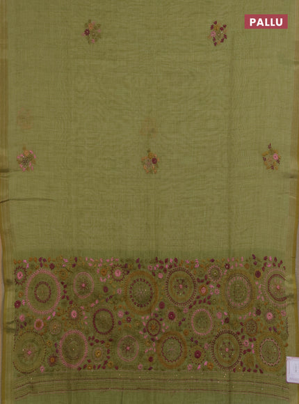 Linen saree light green with embroidery buttas and embroidery pallu