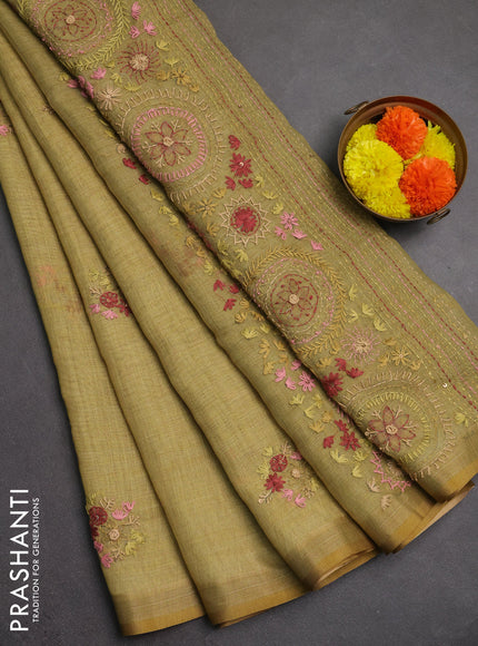 Linen saree green with embroidery buttas and embroidery pallu