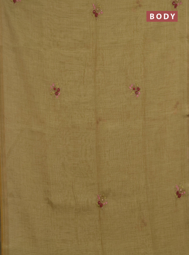 Linen saree green with embroidery buttas and embroidery pallu